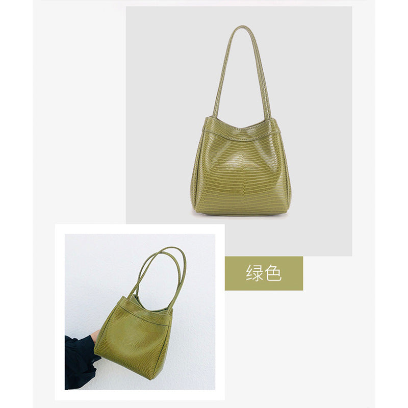 Light luxury trend 2023 spring and summer new niche design fashionable women's bag first-layer cowhide water snake pattern portable bucket bag